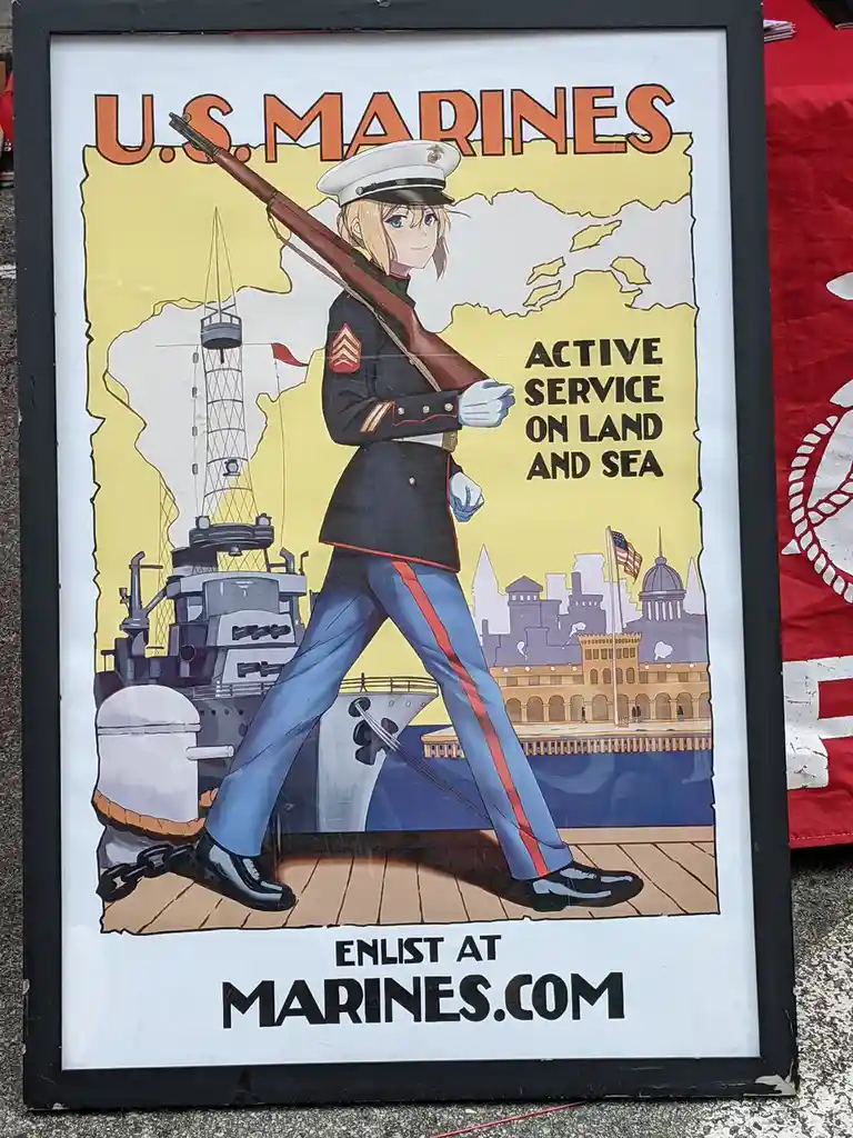 A framed U.S. Marines recruitment poster features an anime-style female marine in uniform holding a rifle, standing on a…