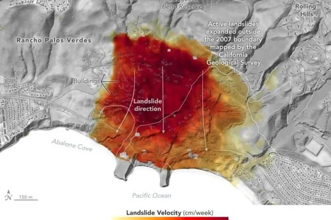 A topographical map shows a large red-orange area indicating landslide velocity near the Pacific Ocean, with labels for…
