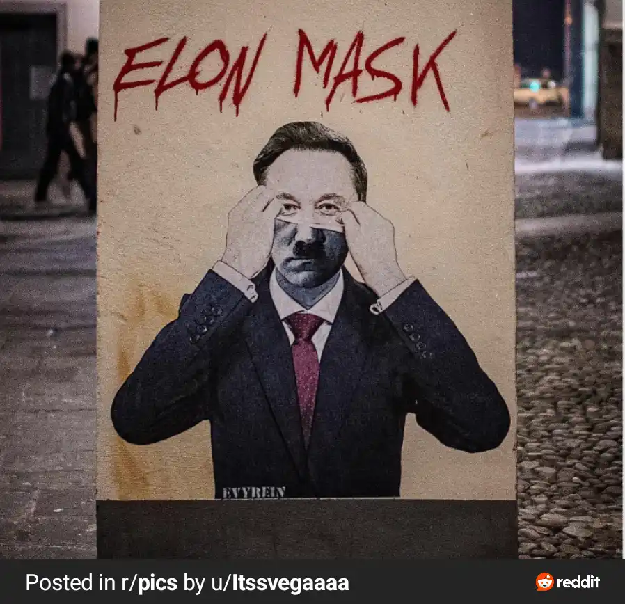 A street art poster shows a man in a suit and tie holding a mask over his face, with the words 'ELON MASK' written in red…