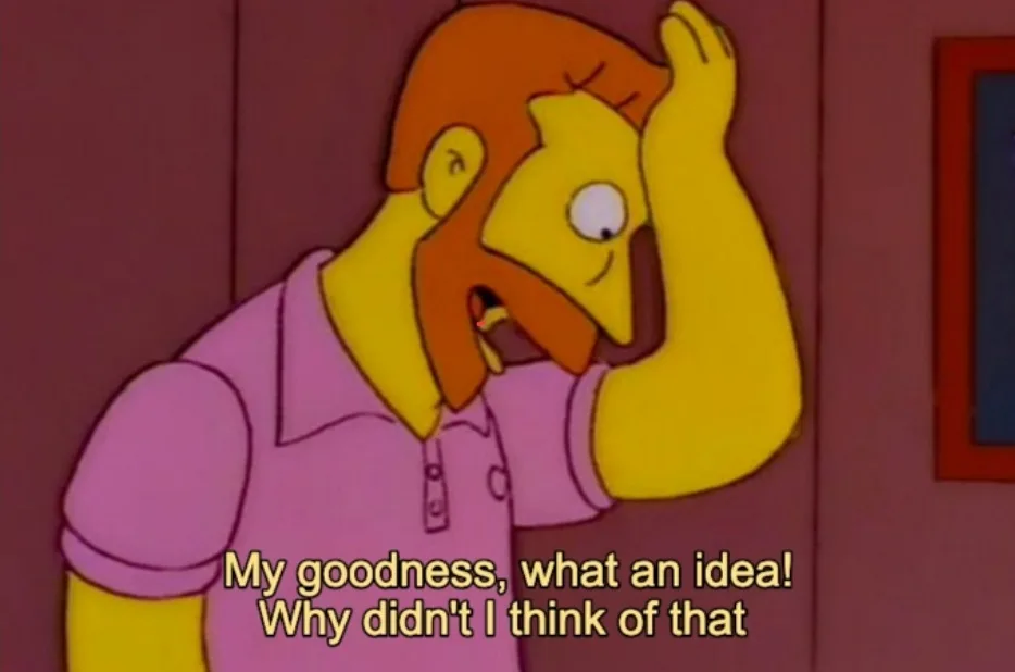 A cartoon man with orange hair and beard, wearing a pink polo shirt, holds his head in his hand with a look of exaggerated…