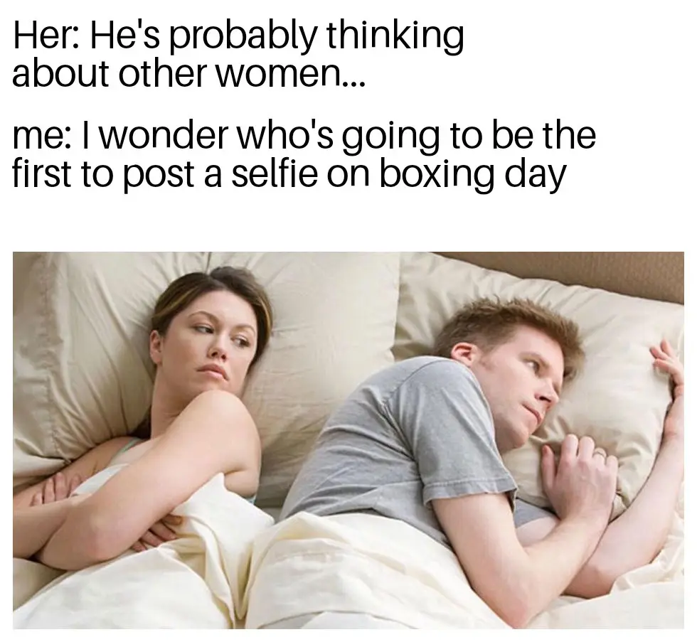 A man and woman lie in bed, turned away from each other, appearing to be in a disagreement. The woman looks annoyed, while…