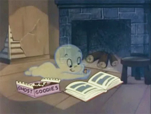 A cartoon ghost sits on a wooden floor in front of a stone fireplace, reading an open book while a pink box labeled 'GHOST…