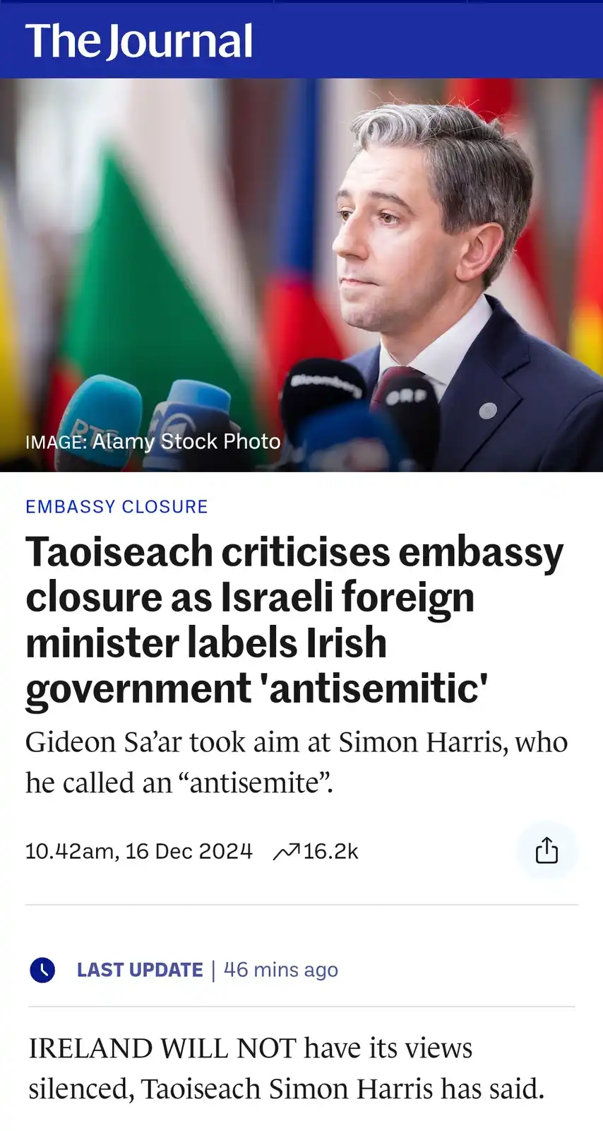 A screenshot of a news article from 'The Journal' shows a photo of Irish Taoiseach Simon Harris at a press conference with…