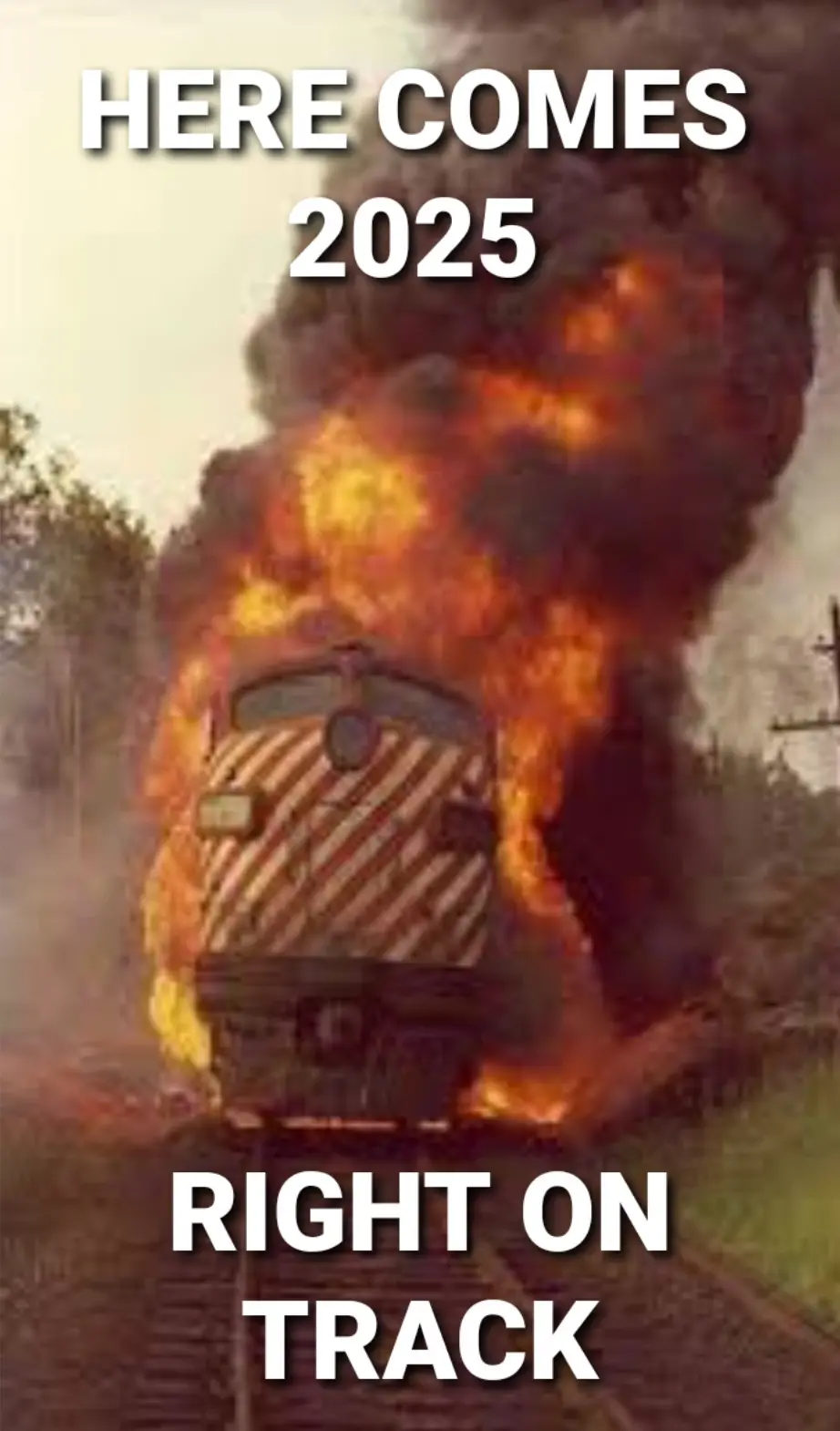A train is engulfed in flames and thick black smoke as it approaches on railway tracks. White bold text overlaid at the top…