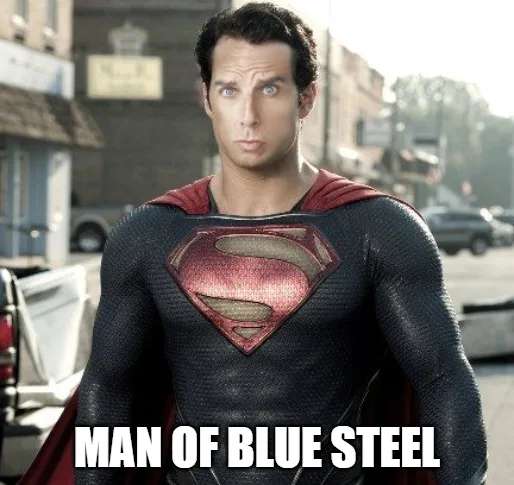 A man in a Superman costume with a surprised expression stands on a city street. The text 'MAN OF BLUE STEEL' is overlaid in…