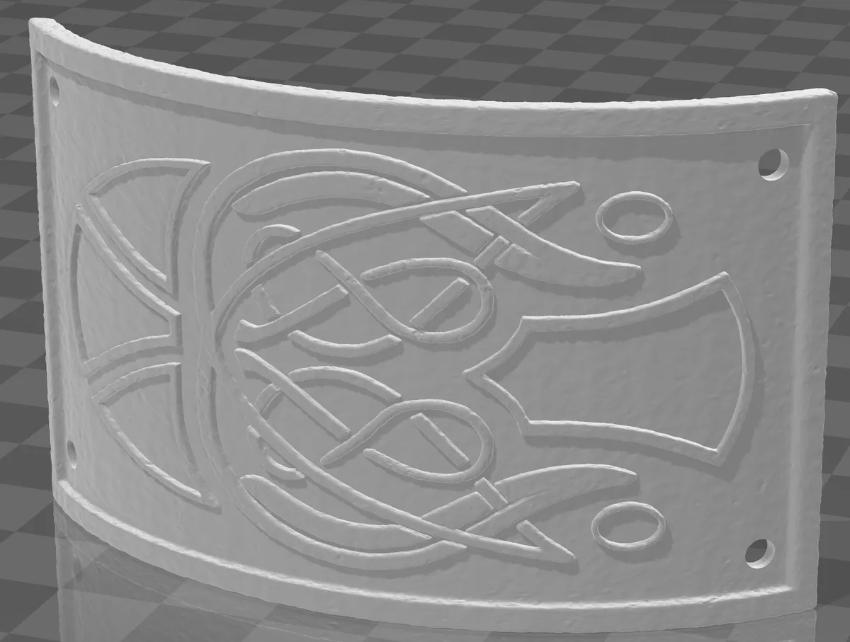 A grayscale 3D render of a curved, textured metal plate with embossed, abstract swirling patterns and four holes, set…