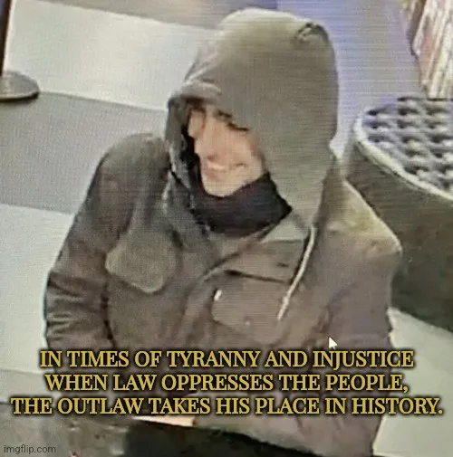 A grainy, low-resolution security camera image shows a person wearing a dark hooded jacket and a dark scarf, smiling while…