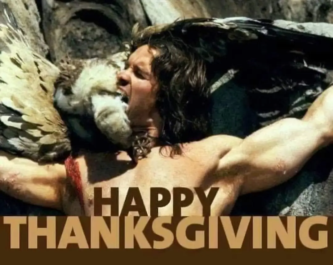 A shirtless, muscular man with long dark hair lies on rocky ground, clutching a large bird of prey with dark and light…