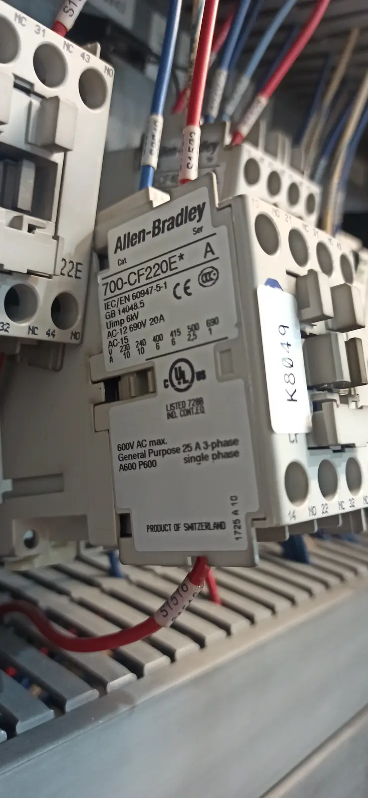 A close-up photo of an Allen-Bradley electrical contactor labeled 'PRODUCT OF SWITZERLAND' despite being manufactured in the…