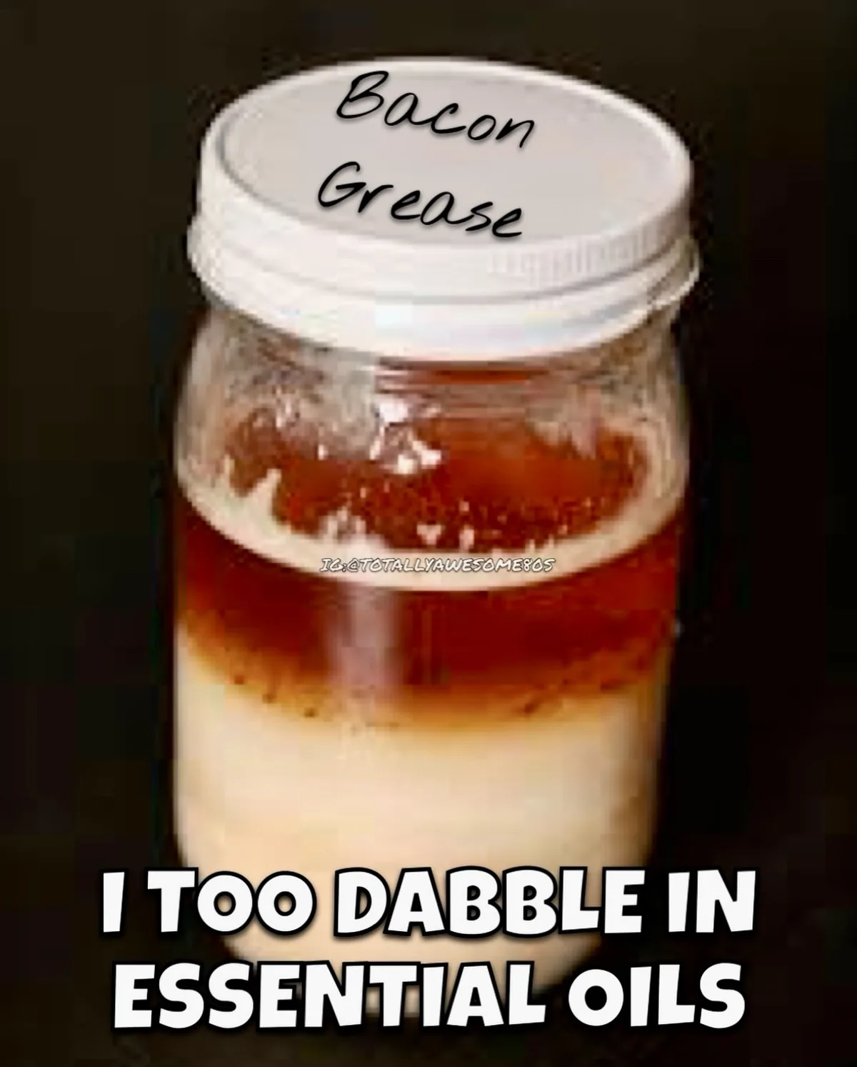 A glass jar with a white lid labeled 'Bacon Grease' contains two distinct layers: a clear amber liquid on top and a white…