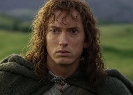 A close-up of a man with long, wavy brown hair and a green cloak, looking shocked or alarmed. He is outdoors in a grassy…