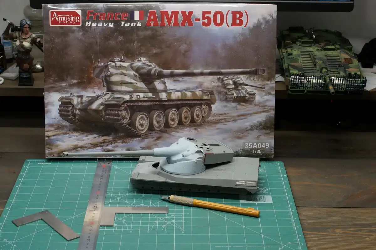 A partially assembled 1/35 scale AMX-50(B) French heavy tank model sits on a green cutting mat next to a ruler and hobby…