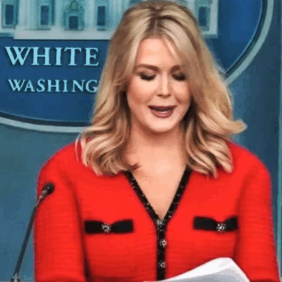 A four-panel image shows a blonde woman in a red cardigan speaking at a podium with a 'WHITE WASHING' logo behind her. The…