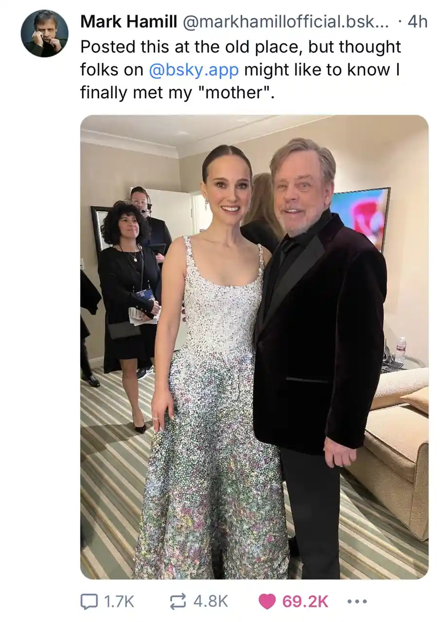 A photo shows actor Mark Hamill standing beside actress Natalie Portman at what appears to be a formal event. He is wearing…