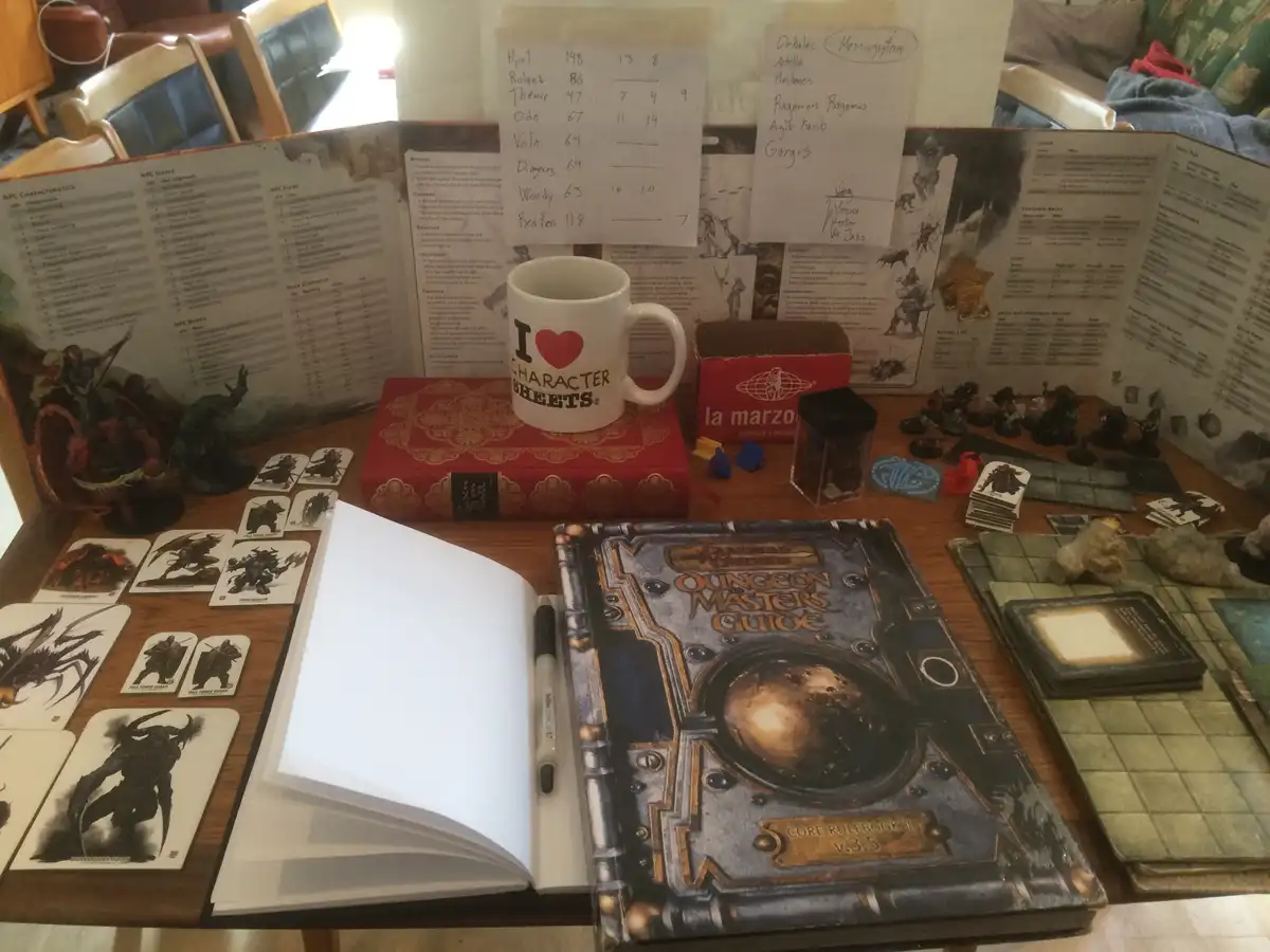 A cluttered tabletop is set up for a Dungeons & Dragons game, featuring the 'Dungeon Master's Guide' core rulebook…
