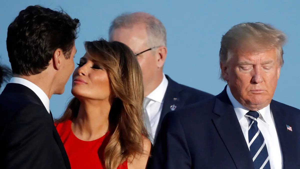 A photo shows Melania Trump in a red dress kissing a man in a suit while Donald Trump stands nearby with his eyes closed and…