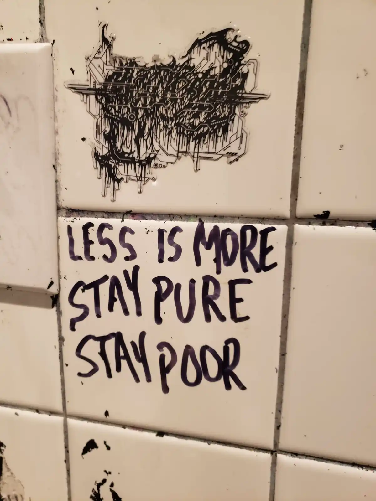A close-up of white bathroom tiles with black graffiti. Above the text is a dripping, circuit-board-style illustration. The…