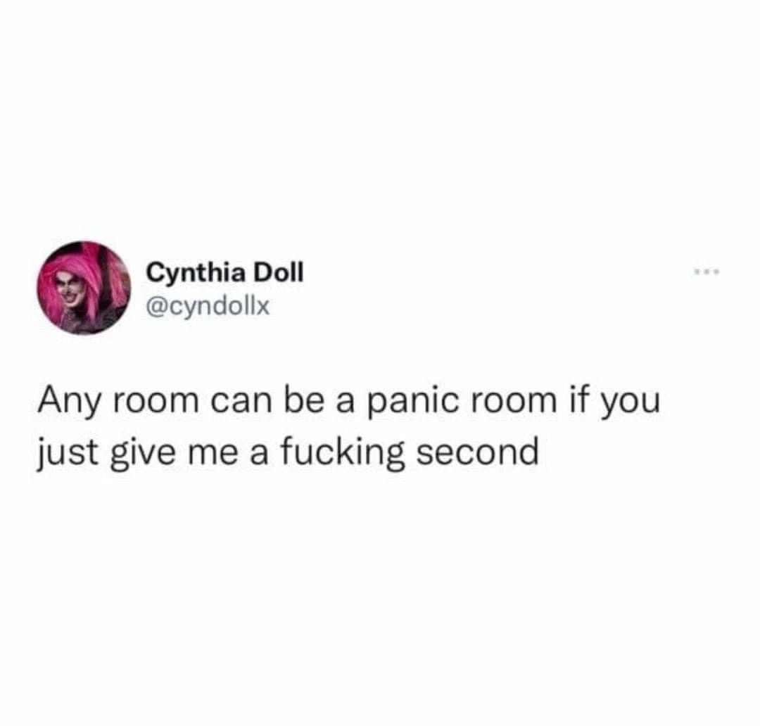 A screenshot of a tweet by Cynthia Doll (@cyndollx) featuring her profile picture with pink hair and dramatic makeup. The…