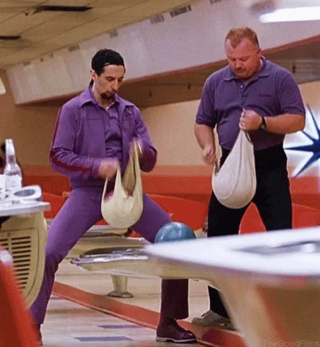 A six-panel image sequence from the TV show 'The Good Place' shows two men in purple uniforms at a bowling alley. The man on…
