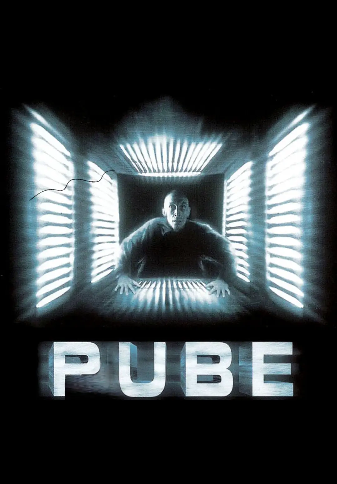 A man with a bald head is shown in a dark, futuristic-looking chamber with glowing blue light panels on the walls and…