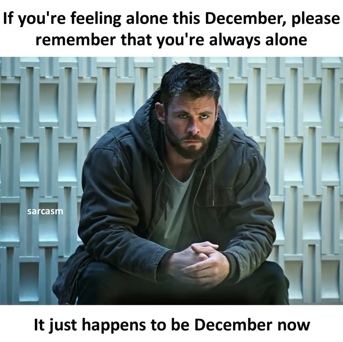 A man with a serious, intense expression sits on the ground in front of a white geometric wall. The overlaid text reads: 'If…