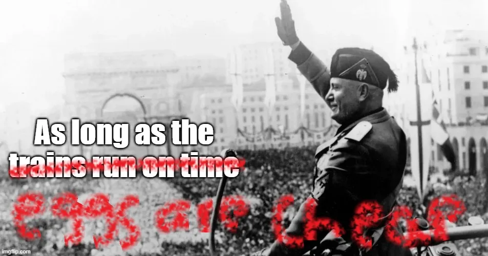 A black-and-white historical photo shows a man in a military uniform waving to a crowd with the Arc de Triomphe visible in…