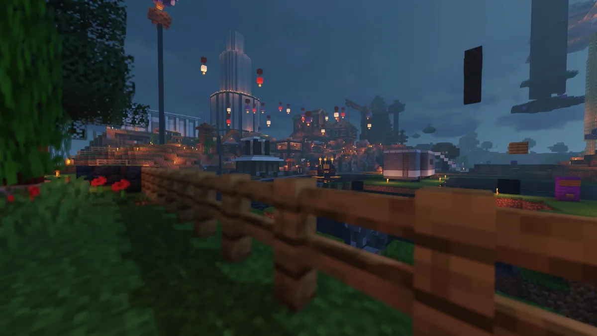 A screenshot from the game Minecraft shows a player's perspective looking over a wooden fence at a sprawling, intricately…