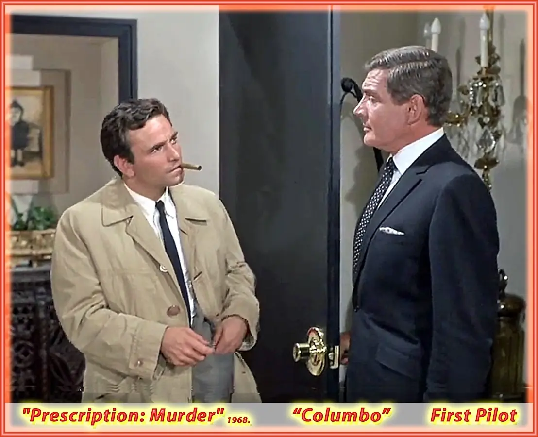 Two men stand in an indoor setting, one in a beige trench coat with a cigar in his mouth looking up at the other, who is in…