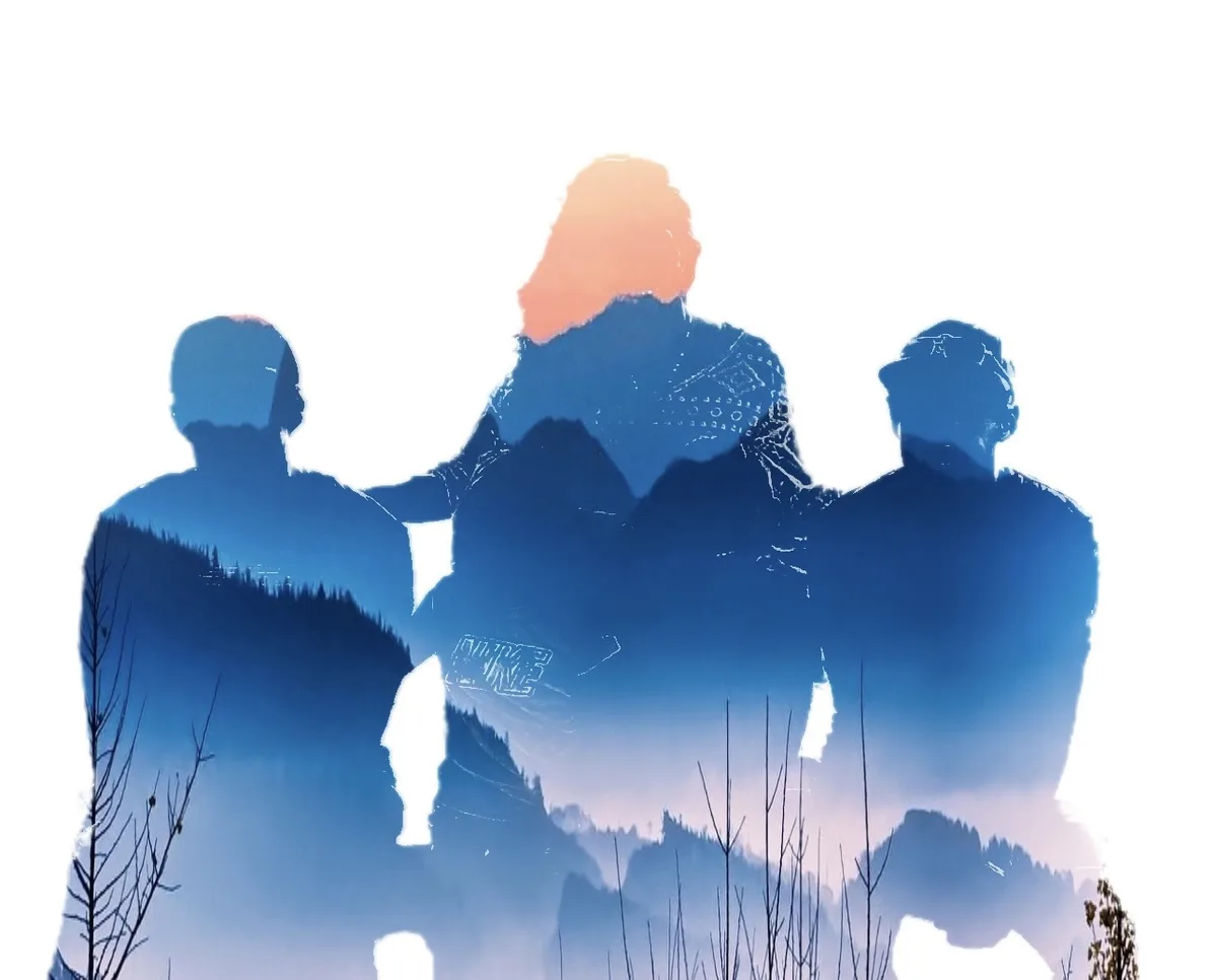 The image shows three silhouetted figures standing side by side, their outlines layered over a scenic landscape of mountains…