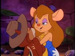 A cartoon mouse with long brown hair, wearing a blue dress and holding a brown hat, looks annoyed while sitting in a rocky…