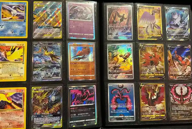 A collection of Pokémon trading cards featuring Articuno, Zapdos, and Moltres, arranged in a binder. The cards include…