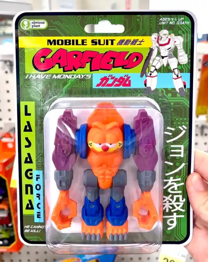 A toy package parodying a Gundam-style mobile suit, featuring the orange cat Garfield in a robotic form with purple and blue…