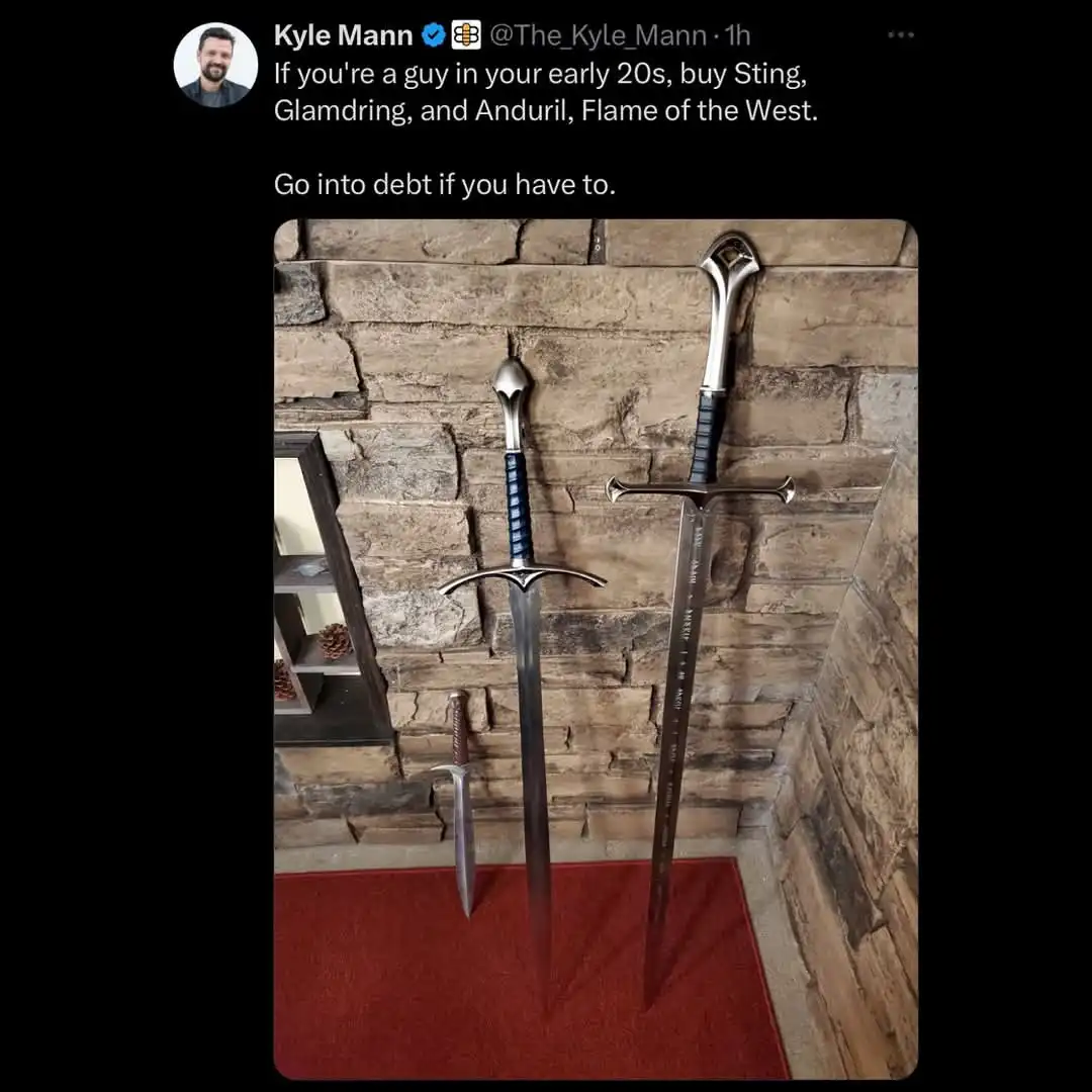 Three fantasy swords — Sting, Glamdring, and Anduril — are displayed upright against a stone wall on a red rug. The overlaid…