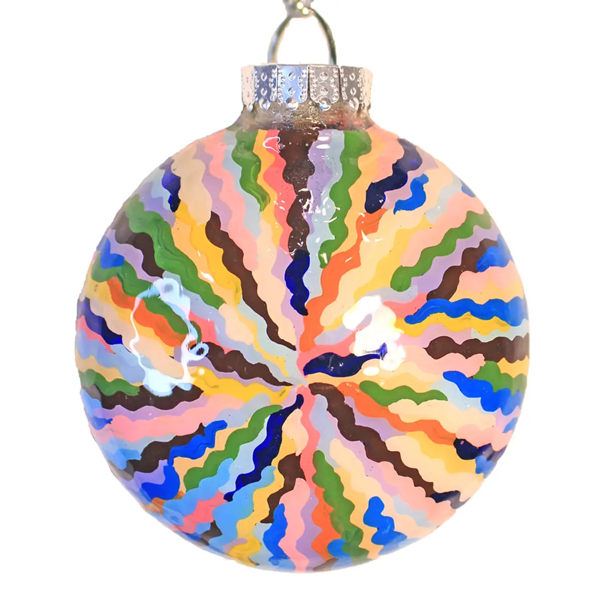 A close-up of a round, glass Christmas ornament with a silver cap and hanging loop, decorated with a chaotic, wavy pattern…