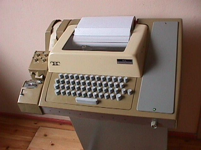 A beige, vintage, mechanical typewriter with a paper stack sits on a wooden desk. The overlaid text reads 'i'm not lazy, i'm…