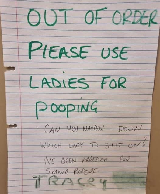 A handwritten note on lined paper, written in green marker, humorously replaces a public restroom sign. The top part reads…