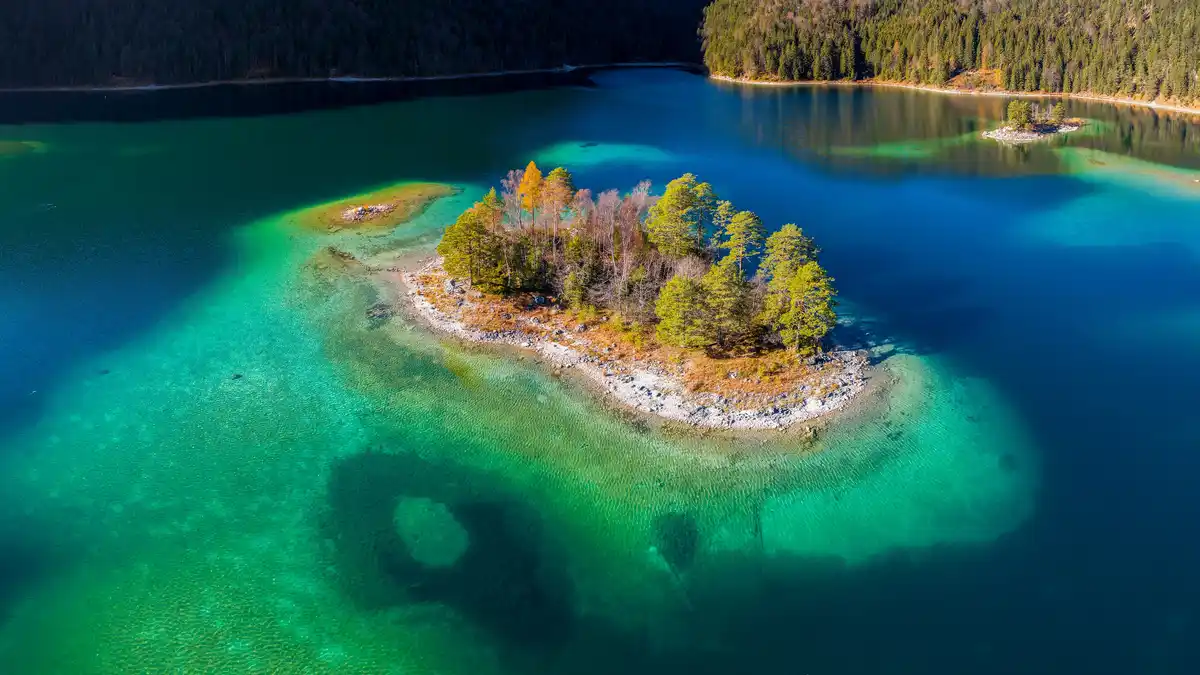 Nestled among the Alps, Eibsee lake is a popular destination for hikers, beachgoers, and tramway riders. From the mainland…