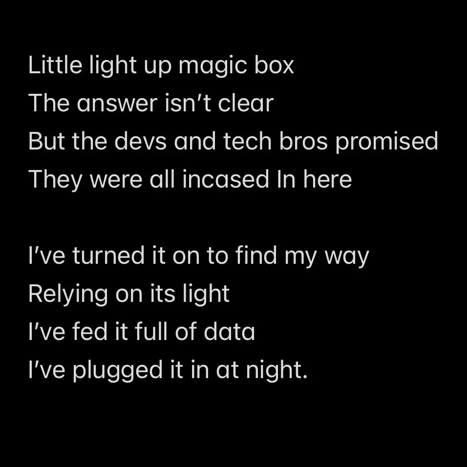 A black background with white text that reads a poem about a 'little light up magic box' that users believe contains answers…