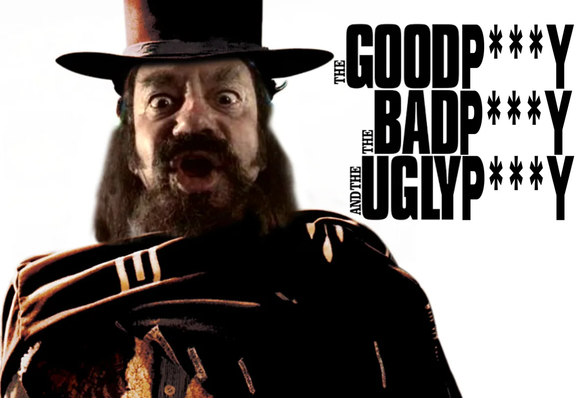 A close-up image of a man with a long beard and a top hat, wearing a dark coat with ornate gold trim, his mouth open in an…