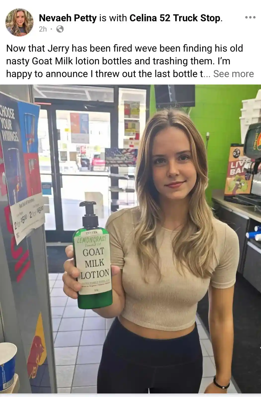A young woman with blonde hair stands in a convenience store, holding up a green bottle labeled 'GOAT MILK LOTION' with a…