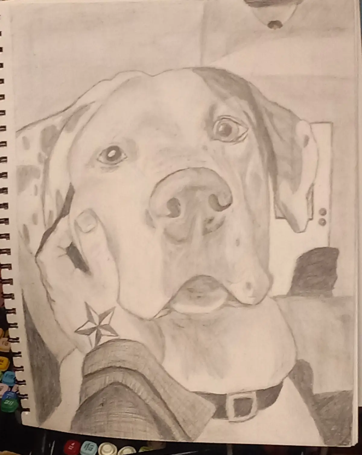 A pencil sketch of a dog's face, drawn in a human-like portrait style, with a hand holding its cheek. The dog wears a…
