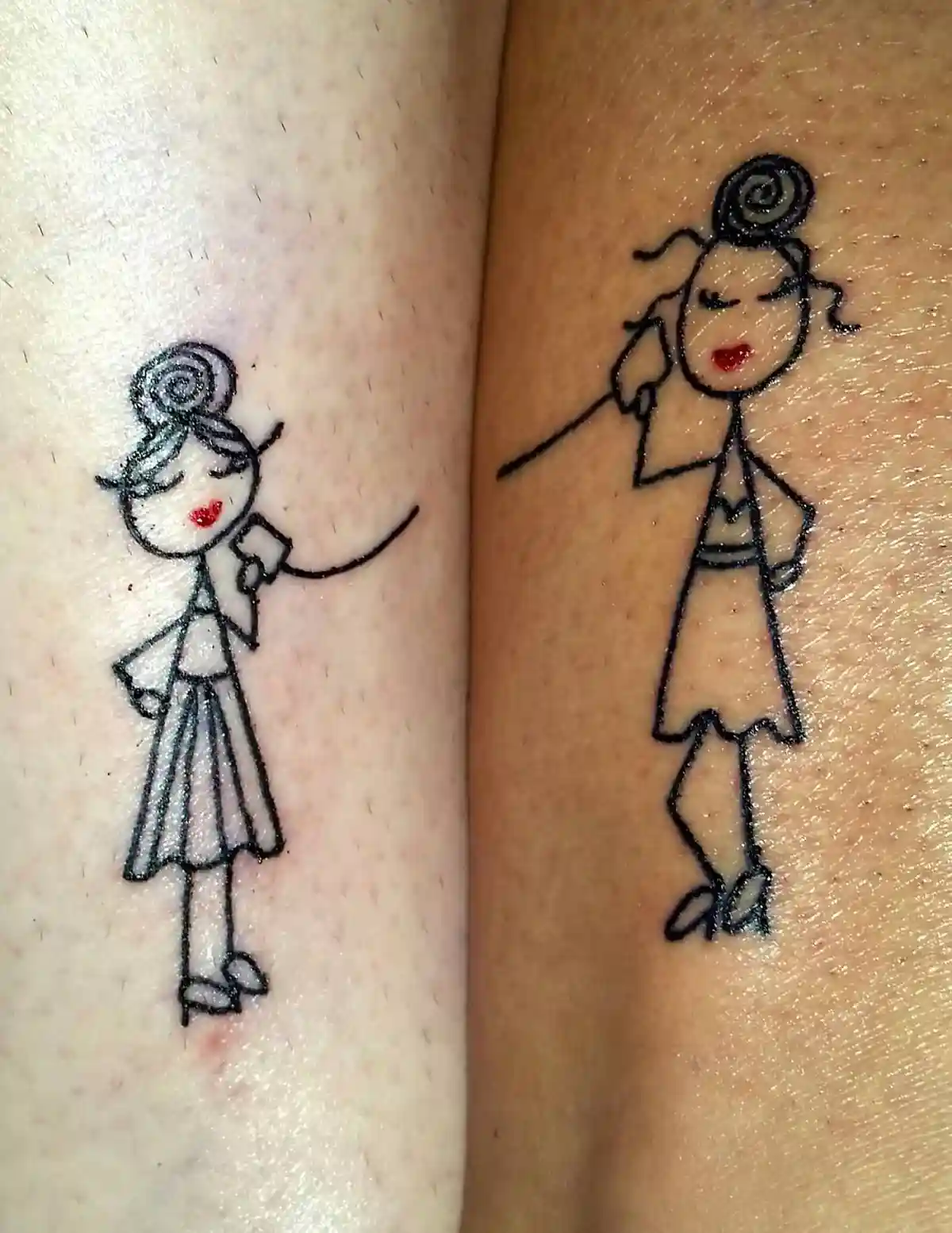 Two matching cartoon-style tattoos of a woman with a spiral hairdo and red lips are shown on adjacent skin. The left tattoo…