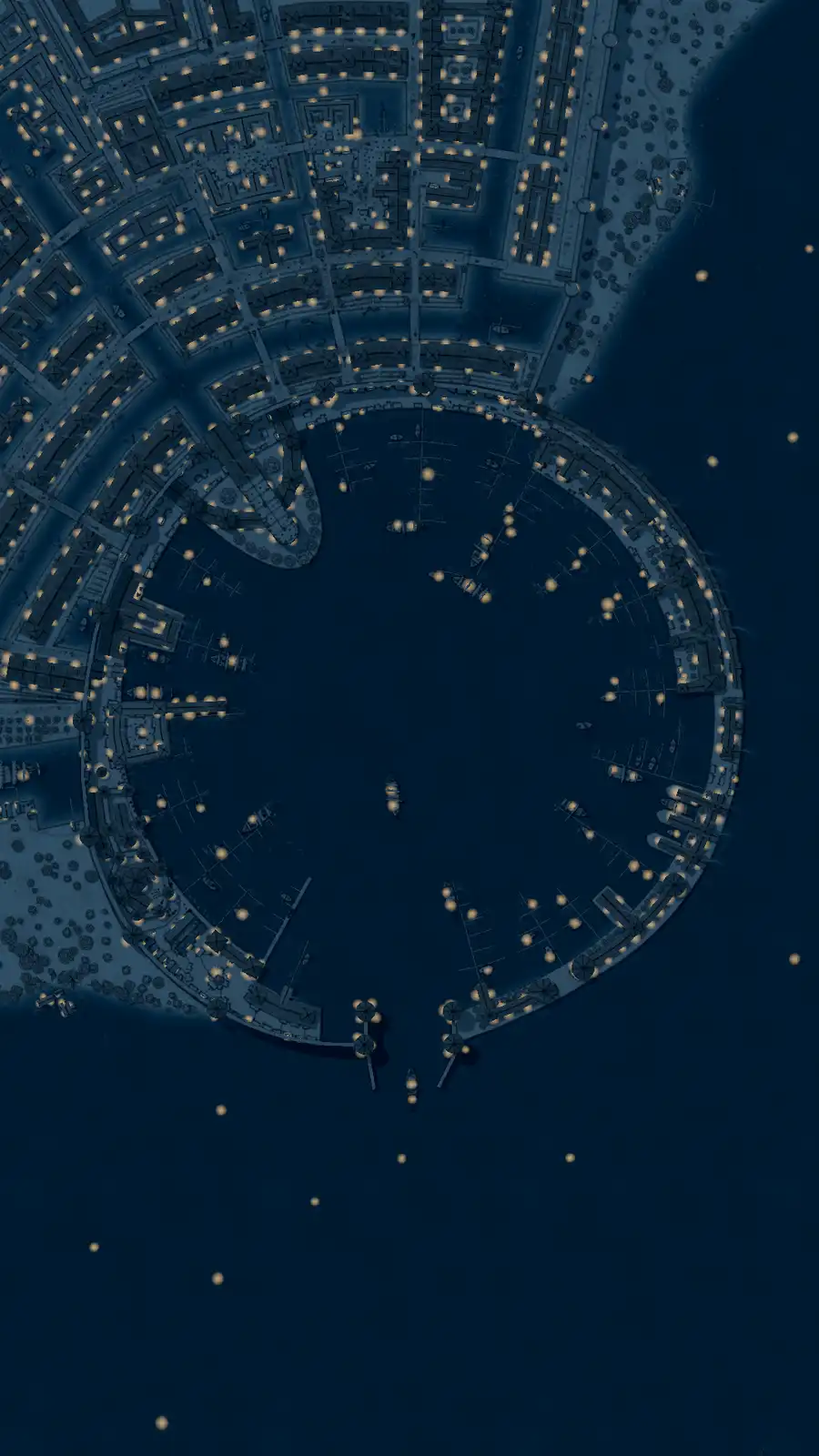 An aerial night view of a circular harbor with illuminated buildings and boats, overlaid with the text 'i'm not a fan of the…