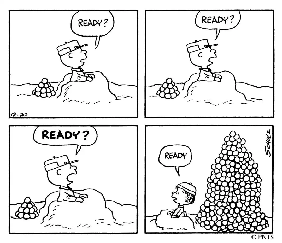 A four-panel black-and-white comic strip shows a boy repeatedly asking 'READY?' while building a small pile of rocks. In the…
