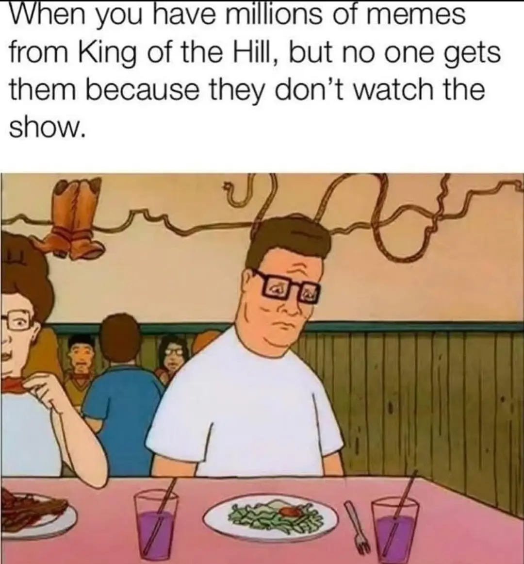 The image shows a scene from the animated TV show 'King of the Hill' featuring the character Hank Hill sitting at a diner…