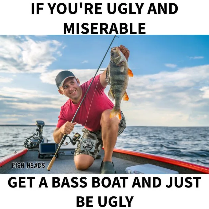 A man in a red shirt and camouflage shorts is kneeling on a red bass boat, holding up a fish he caught with a fishing rod…