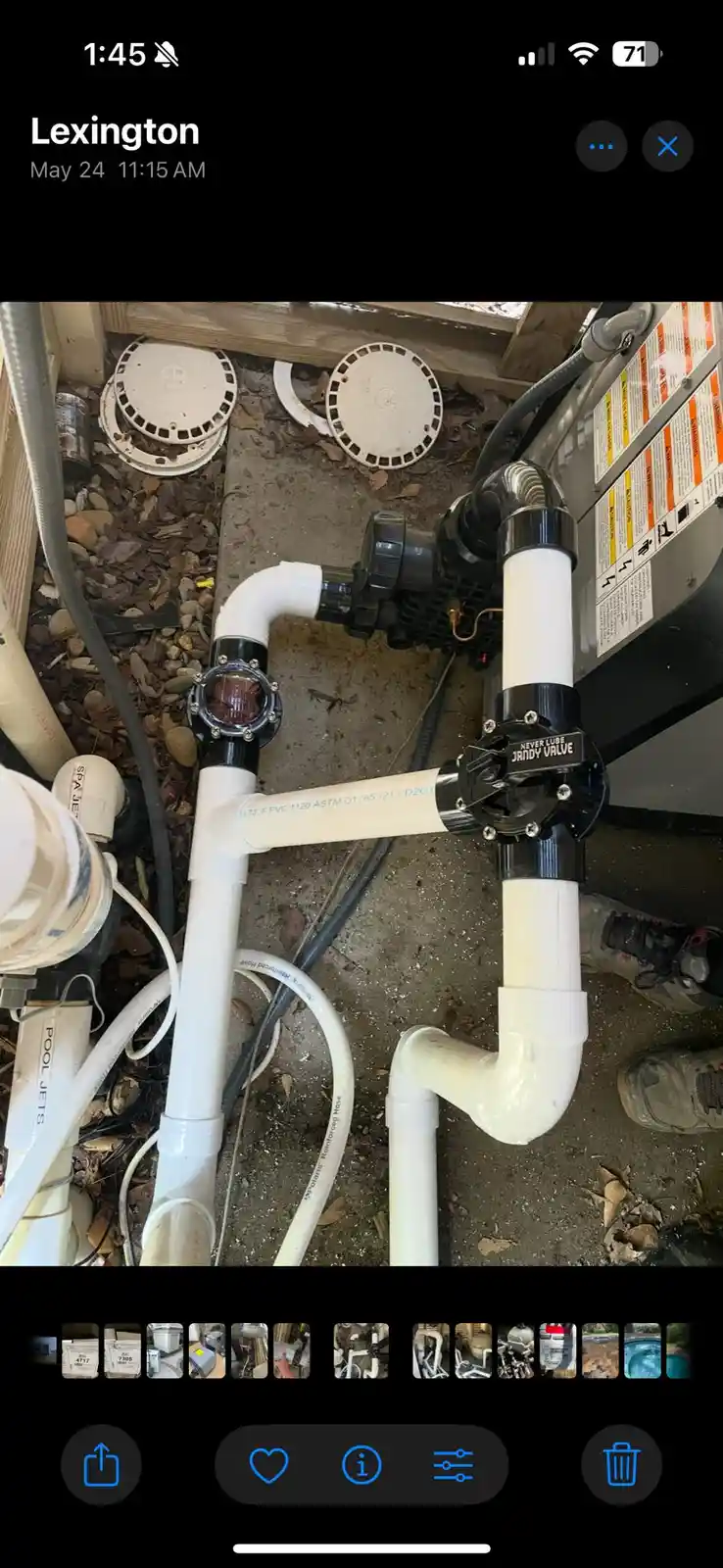 A photo of a complex white PVC plumbing system for a pool, featuring a black valve labeled 'NEVER LUBE JANDY VALVE', with a…