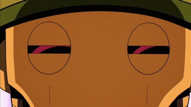 A close-up of an animated character with a brown face and green cap, showing eyes narrowed into thin slits with pinkish-red…