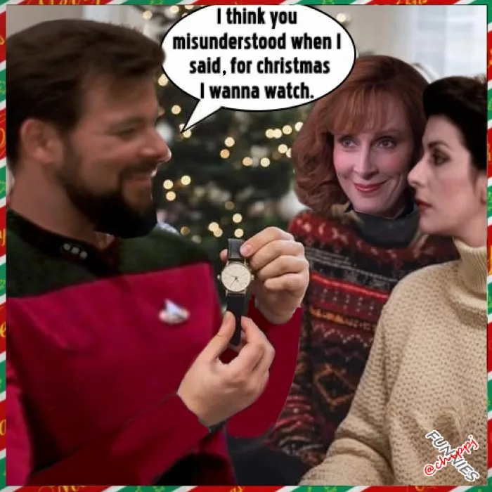 A man in a red Star Trek uniform holds up a watch while smiling, with two women looking on. A speech bubble above his head…