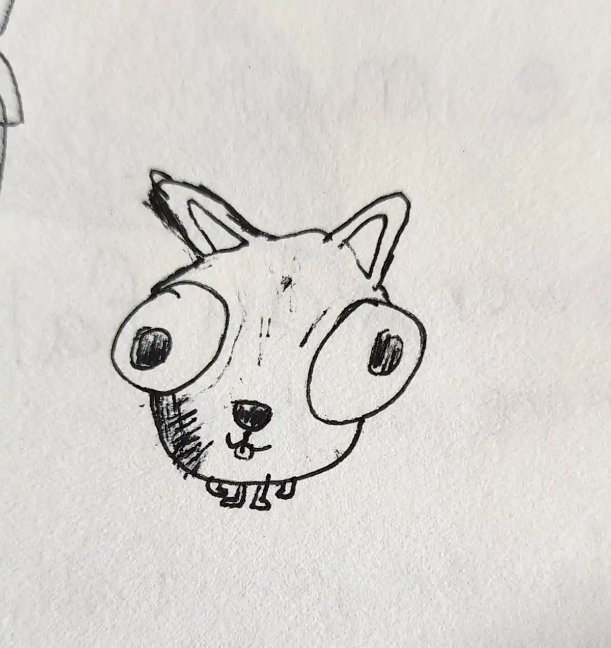 A simple black ink sketch on textured white paper shows a cartoon animal head with large round eyes, pointed ears, and a…